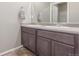 Bathroom featuring a double vanity with modern fixtures and neutral color scheme, offering functionality at 5758 Echo Park Cir, Castle Rock, CO 80104