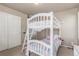 Cozy bedroom showcasing a white bunk bed, closet, and mirror, creating a playful atmosphere at 5758 Echo Park Cir, Castle Rock, CO 80104