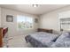 Bright bedroom with a bed, dresser, and window, creating a serene retreat at 5758 Echo Park Cir, Castle Rock, CO 80104