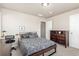 Neutral bedroom featuring a full bed, desk, and dresser, creating a comfortable space at 5758 Echo Park Cir, Castle Rock, CO 80104