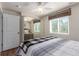 Bright bedroom featuring a mirror sliding door closet, ceiling fan and natural light at 5758 Echo Park Cir, Castle Rock, CO 80104