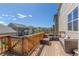 Outdoor deck featuring patio furniture with neighborhood views and a wooden railing at 5758 Echo Park Cir, Castle Rock, CO 80104