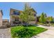 Attractive two-story home with a well-manicured lawn, stone accents, and convenient two-car garage at 5758 Echo Park Cir, Castle Rock, CO 80104