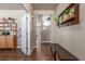 Entryway featuring hardwood floors, decorative shelving, and a view into the home at 5758 Echo Park Cir, Castle Rock, CO 80104