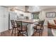 Stylish kitchen island with bar seating and modern appliances, perfect for entertaining at 5758 Echo Park Cir, Castle Rock, CO 80104