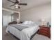 Large main bedroom featuring soft carpet, ceiling fan, and a door leading to another room at 5758 Echo Park Cir, Castle Rock, CO 80104