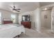 Spacious main bedroom with a ceiling fan, modern furniture and natural light coming through the window at 5758 Echo Park Cir, Castle Rock, CO 80104