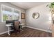 Bright home office space with hardwood floors, a large window, and modern furnishings at 5758 Echo Park Cir, Castle Rock, CO 80104