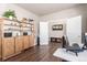 Spacious home office featuring hardwood floors, ample storage, and a view into the hallway at 5758 Echo Park Cir, Castle Rock, CO 80104