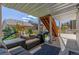 Covered patio with comfortable seating, a grill and a backyard playset for outdoor enjoyment at 5758 Echo Park Cir, Castle Rock, CO 80104
