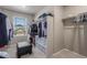 Functional walk-in closet providing storage and organization with natural light streaming in at 5758 Echo Park Cir, Castle Rock, CO 80104