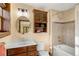 Bathroom with vanity, soaking tub, wood accents and natural light at 28532 Hummingbird Hill Rd, Conifer, CO 80433