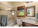 Bathroom with shower-tub combo, granite countertops and wood-framed mirror at 28532 Hummingbird Hill Rd, Conifer, CO 80433