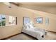 Bright bedroom with vaulted ceilings, multiple windows with natural light, and neutral tones at 28532 Hummingbird Hill Rd, Conifer, CO 80433