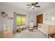 Bright Bedroom with neutral tones, featuring a crib and natural light from the window at 28532 Hummingbird Hill Rd, Conifer, CO 80433