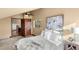 Comfortable bedroom with ceiling fan, warm tones, stylish decor, and a glimpse of stairs at 28532 Hummingbird Hill Rd, Conifer, CO 80433