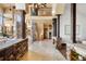 Elegant foyer with stone accents, soaring ceilings and beautiful tile flooring at 28532 Hummingbird Hill Rd, Conifer, CO 80433
