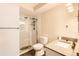 Modern bathroom featuring a glass-enclosed shower, granite countertop vanity, and contemporary fixtures at 9300 E Center Ave # 3A, Denver, CO 80247