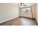 Bedroom with a window bringing in natural light and wood-look flooring at 9300 E Center Ave # 3A, Denver, CO 80247