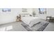 Comfortable bedroom featuring a plush bed, area rug, and modern decor at 3450 S Eagle St # 101, Aurora, CO 80014