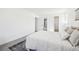 A bright bedroom offers an ensuite bathroom and a neutral color palette at 3450 S Eagle St # 101, Aurora, CO 80014
