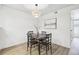 An intimate dining area features modern lighting and wood flooring at 3450 S Eagle St # 101, Aurora, CO 80014