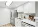 Bright kitchen featuring stainless steel appliances, white cabinets, and modern countertops at 3450 S Eagle St # 101, Aurora, CO 80014