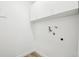 Clean, white laundry room ready for appliances at 3450 S Eagle St # 101, Aurora, CO 80014