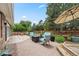 Brick patio area includes comfortable seating and a fire pit, great for relaxation at 5991 S Eudora Way, Centennial, CO 80121