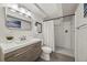 Bathroom with a modern vanity, updated fixtures, and a tiled walk-in shower at 5991 S Eudora Way, Centennial, CO 80121