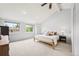 Bright primary bedroom featuring vaulted ceilings, large windows, and ample space at 5991 S Eudora Way, Centennial, CO 80121