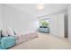 Bright bedroom featuring a single bed, light gray walls, and a window with natural light at 5991 S Eudora Way, Centennial, CO 80121