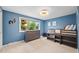 Charming blue bedroom featuring a built-in bed, dresser, and a bright window view at 5991 S Eudora Way, Centennial, CO 80121