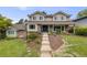Charming two-story home with a landscaped front yard and a welcoming entrance at 5991 S Eudora Way, Centennial, CO 80121