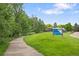 View of community's Heritage Village Park with walking path and sign at 5991 S Eudora Way, Centennial, CO 80121