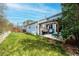 Serene backyard featuring a well-maintained lawn and cozy patio area with a charming pergola at 9765 Merimbula St, Highlands Ranch, CO 80130