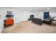 Finished basement includes a desk, sofa and TV at 9765 Merimbula St, Highlands Ranch, CO 80130