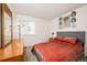Comfortable bedroom with a soft bed, stylish decor, and ample natural light at 9765 Merimbula St, Highlands Ranch, CO 80130