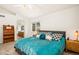 Bright bedroom with a comfortable bed, an ensuite bathroom, and a serene atmosphere at 9765 Merimbula St, Highlands Ranch, CO 80130