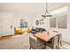 Bright living room with vaulted ceilings, neutral carpet, and ample natural light at 9765 Merimbula St, Highlands Ranch, CO 80130