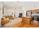Open-concept living space featuring a modern kitchen and comfortable seating area at 9765 Merimbula St, Highlands Ranch, CO 80130
