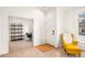 Welcoming entryway featuring a view into a home office and a cozy armchair at 9765 Merimbula St, Highlands Ranch, CO 80130