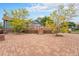 Spacious backyard with a large brick patio and a wooden deck with hot tub at 7930 Alkire St, Arvada, CO 80005