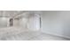 Finished basement with plush neutral carpeting, freshly painted walls, and modern recessed lighting at 7930 Alkire St, Arvada, CO 80005