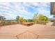 Large wooden deck featuring a built-in hot tub and scenic views of the surrounding landscape at 7930 Alkire St, Arvada, CO 80005
