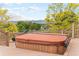 Backyard hot tub overlooking a green lawn with trees at 7930 Alkire St, Arvada, CO 80005