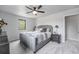 Tranquil primary bedroom showcasing plush carpeting, neutral tones, and ample natural light at 7930 Alkire St, Arvada, CO 80005