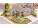 A sprawling property with lush landscaping, a well-maintained lawn, and an attached three-car garage at 8922 S Tuscany Ln, Highlands Ranch, CO 80130