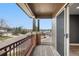 Balcony with wooden deck and brick accents, and a view of the neighborhood at 8922 S Tuscany Ln, Highlands Ranch, CO 80130