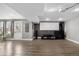 Finished basement area includes a projector screen and exterior door at 8922 S Tuscany Ln, Highlands Ranch, CO 80130